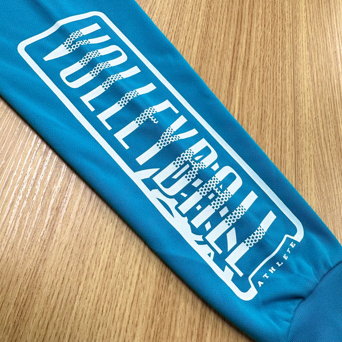 ロングスリーブTシャツ2025 ターコイズ（レッド×ホワイト）